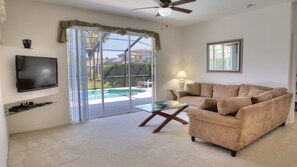 Classic House, 3 Bedrooms with Pool | Living room | 50-inch flat-screen TV with cable channels, TV, DVD player - Cambridge Vacation Home with Pool (Kissimmee)