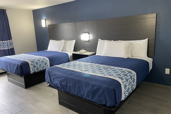 Exclusive Room, 2 Queen Beds | Blackout drapes, iron/ironing board, free WiFi, bed sheets