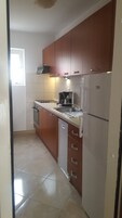 Apartment, 3 Bedrooms | Private kitchen | Fridge, microwave, oven, stovetop