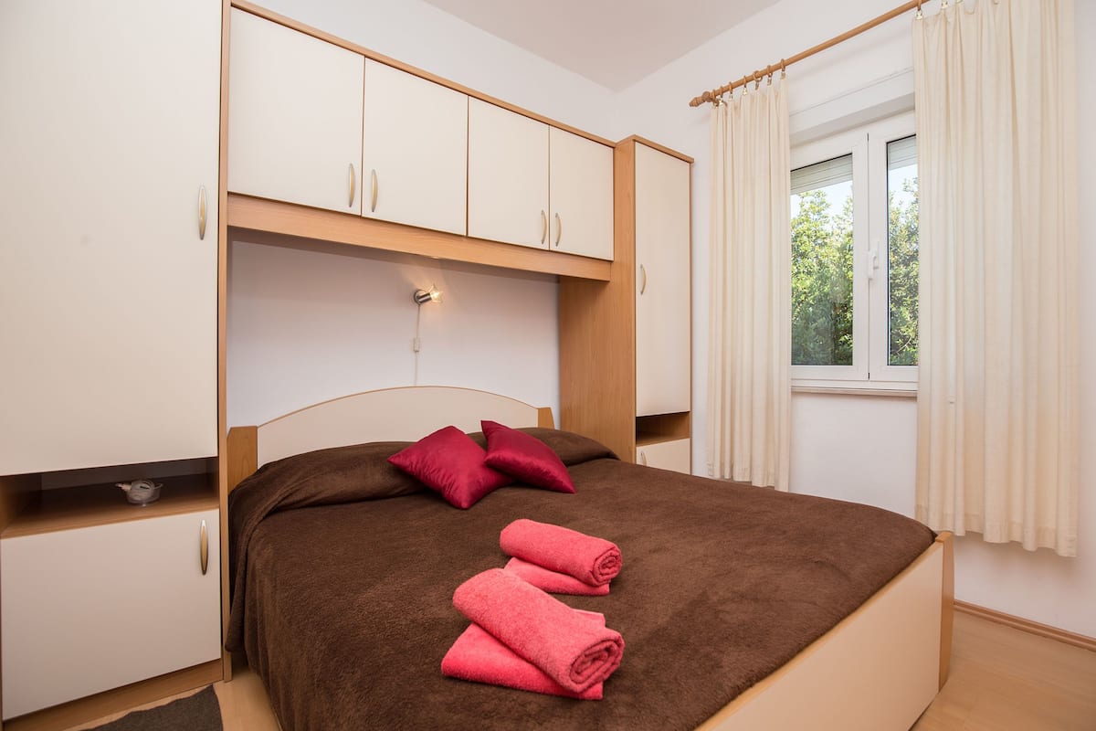 Economy Apartment, Terrace, Garden Area | Desk, blackout drapes, iron/ironing board, free WiFi