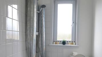 Combined shower/tub, hair dryer, bathrobes, slippers