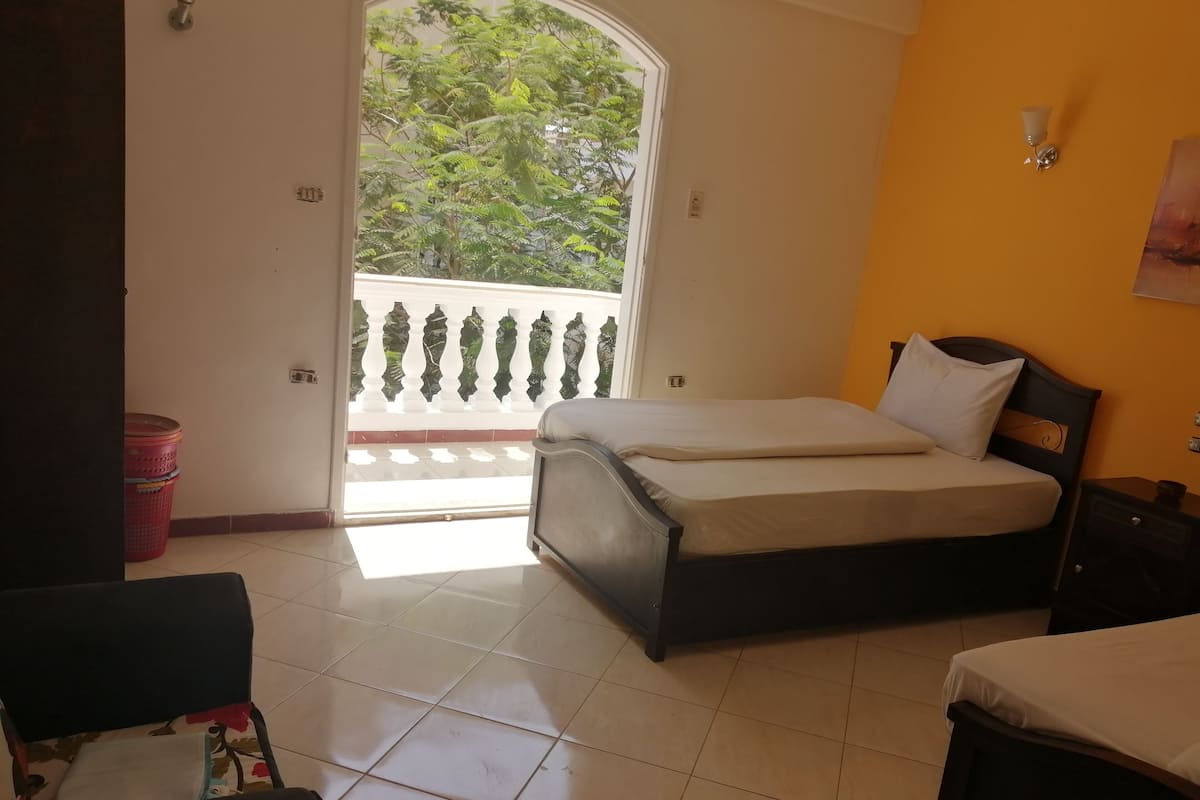 Apartment, 2 Bedrooms | Desk, blackout drapes, iron/ironing board, WiFi (free)