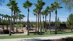 A park with palm trees, playground equipment, and a gazebo. - Your Backyard Oasis Waiting ..., beautiful home in an award winning community (Gilbert)