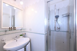 Hair dryer, towels, soap, shampoo