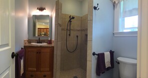 Shower, hair dryer, towels, shampoo