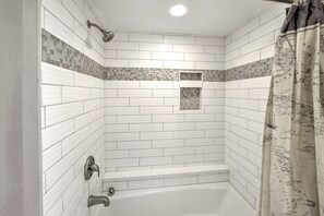 Combined shower/tub, hair dryer, towels - Oceanfront Retreat- Poolside View- Budget Friendly (Daytona Beach)
