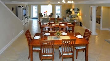 Enjoy meals in this dining area with a large table and eight chairs.