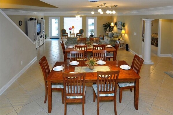 Enjoy meals in this dining area with a large table and eight chairs.