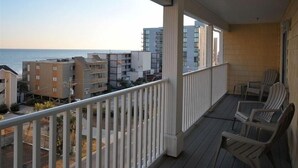 A balcony with a view of the ocean and adjacent buildings. - This is it! Spacious Luxury 8 Bedroom Villa, Pool, Hs Internet (North Myrtle Beach)
