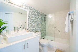 Bathtub, hair dryer, towels, soap