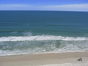 On the beach, sun-loungers
