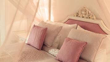 Premium bedding, down comforters, minibar, in-room safe