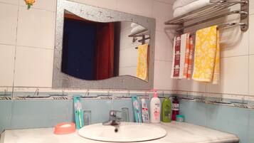 Shower, free toiletries, hair dryer, slippers