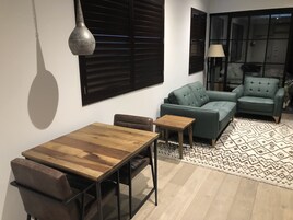 Deluxe Apartment, 1 King Bed, City View (Adults Only) | Living area | 135-cm Smart TV with satellite channels, TV, Netflix