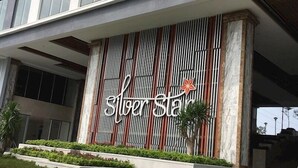 A building facade with a vertical striped pattern and the name 'Silver Star' prominently displayed. - Hung Phat 2 Silver Star Apartment Room TNT (Ho Chi Minh City)