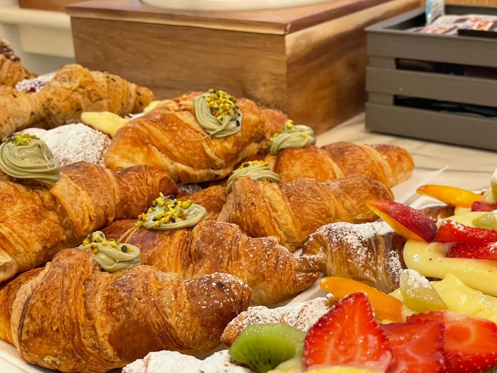 A variety of pastries and fruits on a table.