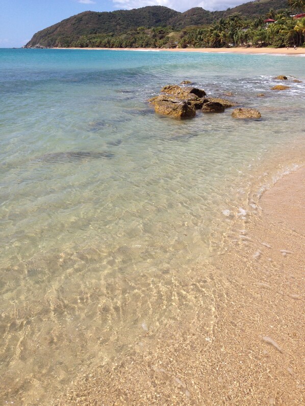 On the beach, sun loungers, beach towels