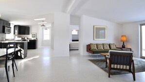 A modern apartment with a kitchen, dining area, and living room. - Fabulous Cottage on Pristine Broad Bay (Waldoboro)