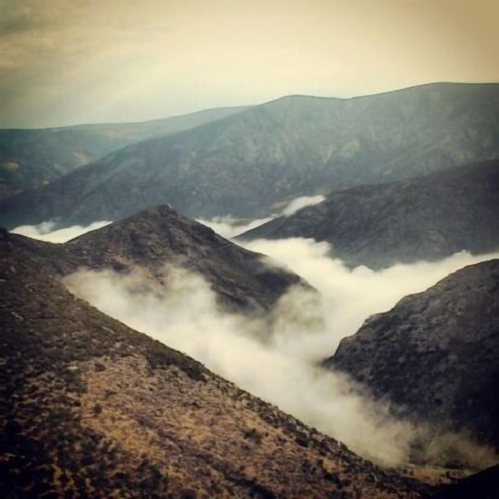 A mountainous landscape with rugged terrain and valleys.