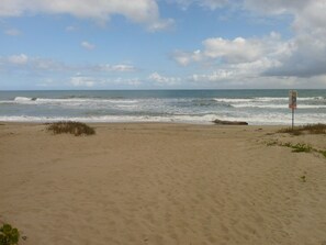 On the beach, sun-loungers