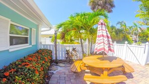 Outdoor dining - Steps to the Beach with Shared Heated Salt Pool and Private Backyard & Grill (Holmes Beach)
