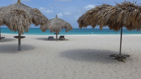 On the beach, sun-loungers, beach towels