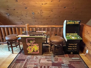 Relax in this inviting room with a bar area for socializing and a unique entertainment feature.