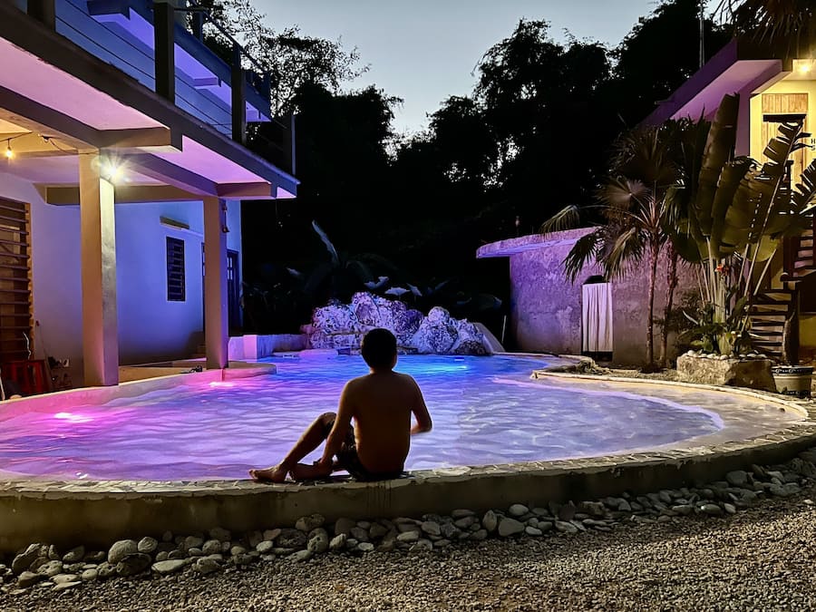 Outdoor pool, open 6:00 AM to 11:00 PM, pool loungers