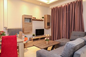 Comfort Apartment, Sea View | Living area | Flat-screen TV - Chrissomallis Apartments (Skiathos)