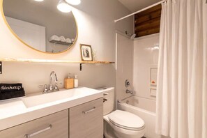 Combined shower/bathtub, hair dryer, towels, soap