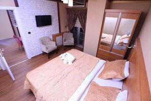 Suite studio Deluxe | 1 chambre, draps en coton égyptien, literie de qualité, minibar