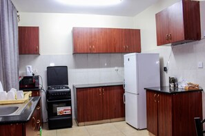 Private kitchen - Your beautiful, clean, quiet, homely travel destination apartment. (Syokimau)
