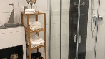 Bathtub, hair dryer, towels, soap