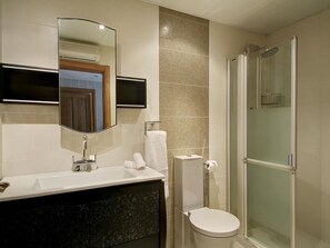 Bathtub, hair dryer, towels, soap