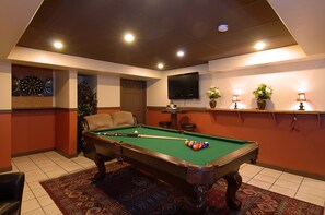 A pool table with balls, a dartboard, and a television on the wall. - 1 Block to Main St, 300 Yds from Ski Lifts (Breckinridge)