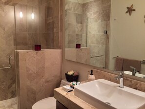 Shower, hair dryer, towels, soap