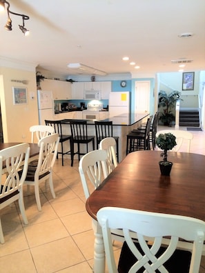 Enjoy meals in the kitchen with a microwave, stove, and refrigerator, and dine at the wooden table with comfortable seating.