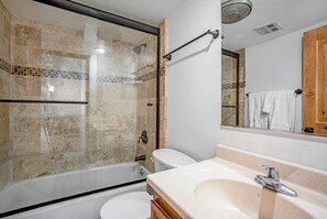 Combined shower/tub, hair dryer, towels, soap