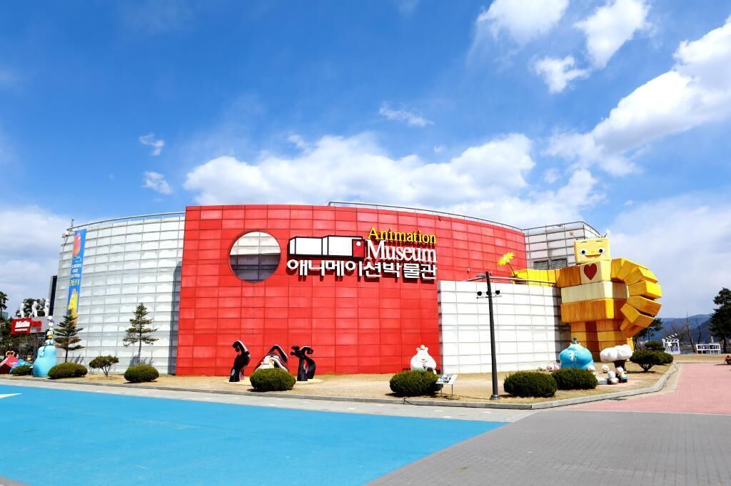 A building with a red and white facade, featuring the text "Animation Museum" and "Animation Museum of Korea".
