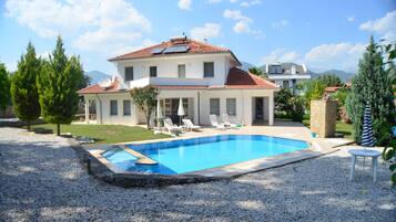 Outdoor pool, pool umbrellas, pool loungers
