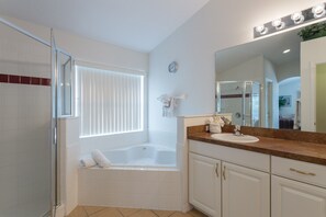 Combined shower/bathtub, hair dryer, towels, soap