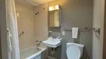 Signature Apartment, 1 Double Bed | Bathroom | Combined shower/tub, deep soaking tub, free toiletries, hair dryer