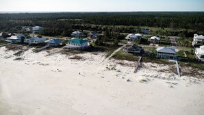 A coastal residential area with houses connected by walkways to a beach. - Salty dog on the rocks (Port St Joe)