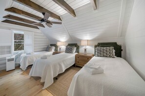 A bedroom with two beds, a ceiling fan, and a window with blinds. - Highland Mist  Pet Friendly, Beautiful Views, Hot Tub, Game Tables, Winery Close by (Banner Elk)