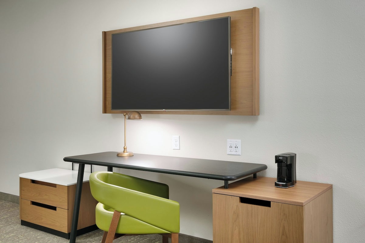 Desk, laptop workspace, blackout drapes, iron/ironing board