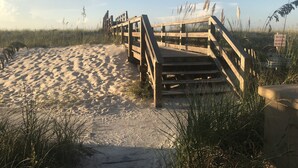 A wooden boardwalk leading to a beach with sand and grass. - Beautiful Gulf Front Complex,White Sandy Beaches, private pool, Paradise Awaits! (Navarre)