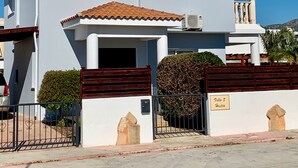 A modern two-story building with a white facade and a brown roof. - Private Villa With Large Private Pool Situated In Coral Bay, Paphos, Cyrprus (coral bay)