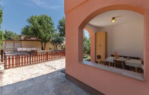 Enjoy a meal in the dining area with a view of the courtyard.