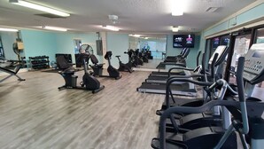 A gym with multiple treadmills, stationary bikes, and dumbbells. - Adorably furnished and updated Ocean Villa condo, with wonderful 200+ Reviews! (Hilton Head Island)