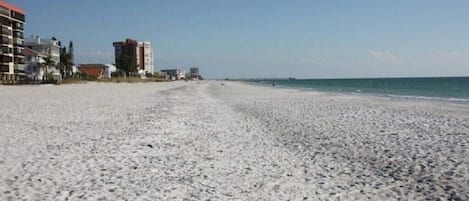 On the beach, sun-loungers, beach towels